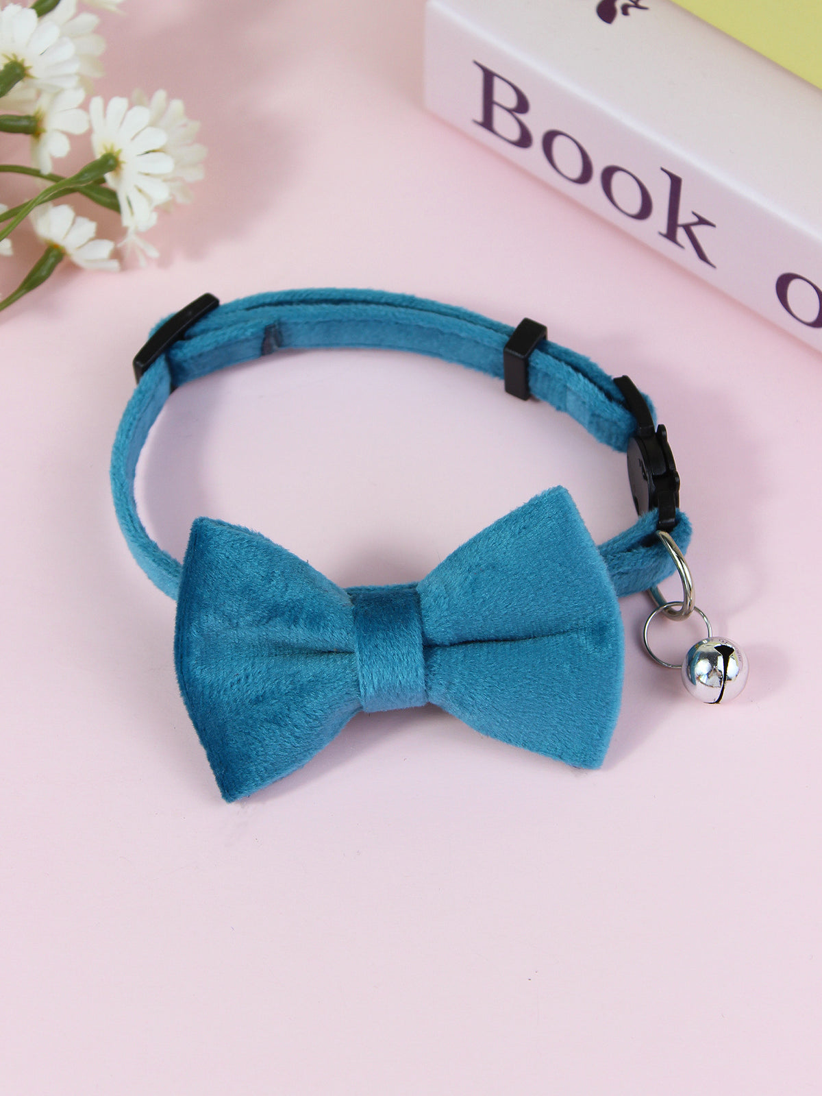 Striped cat collar with velvet bow, available from Pet Royale UK
