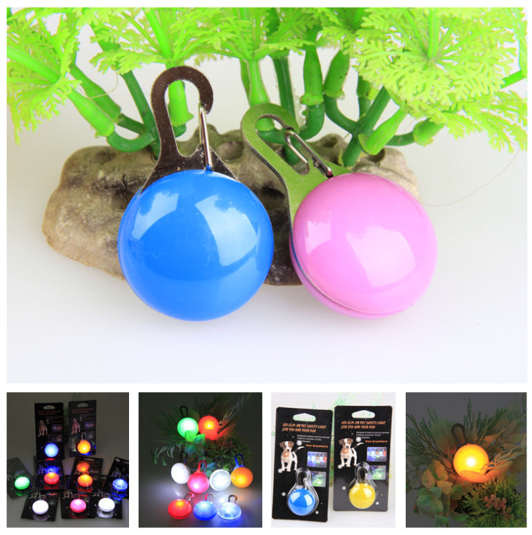 LED collar light pendant glowing blue on a dog collar
