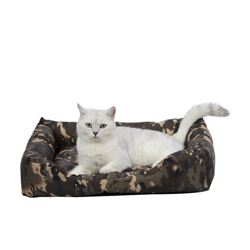 Durable padded pet bed in bold print, close-up detail view