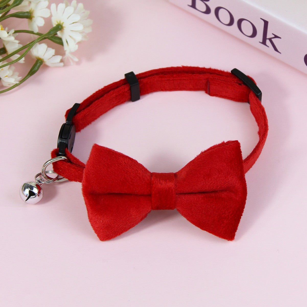 Striped cat collar with velvet bow, available from Pet Royale UK