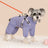 Dog wearing a red windproof four leg coat outdoors