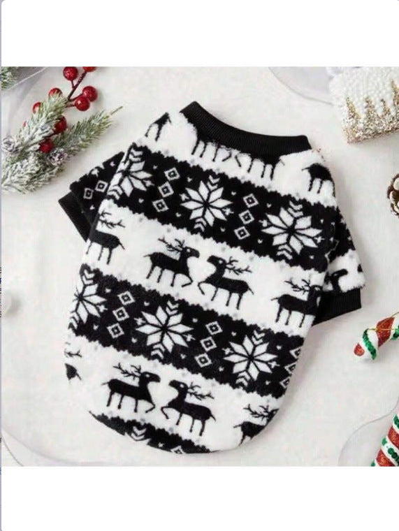 Dog wearing a red Christmas snowflake and reindeer top