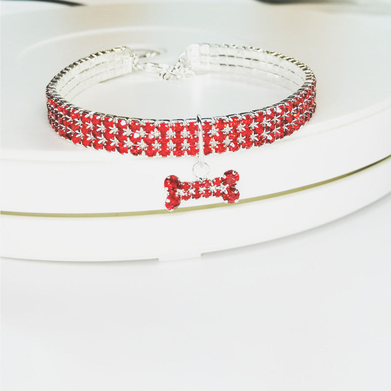 Three row rhinestone elastic collar in pink on a small dog