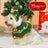 Green festive dog cape with cartoon Christmas design