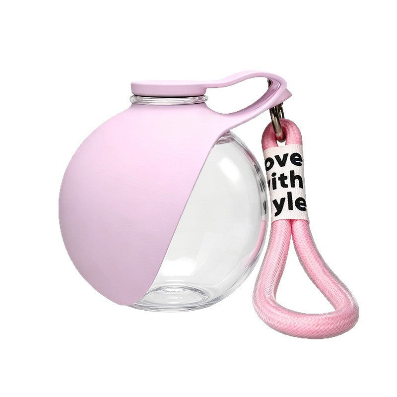 Foldable pet water bottle with ball outlet in Pink, close-up detail