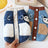 Fleece lined denim pet jacket with panda design in Light Blue Denim, front view