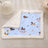 Cat curled up on a planet cat print pet blanket