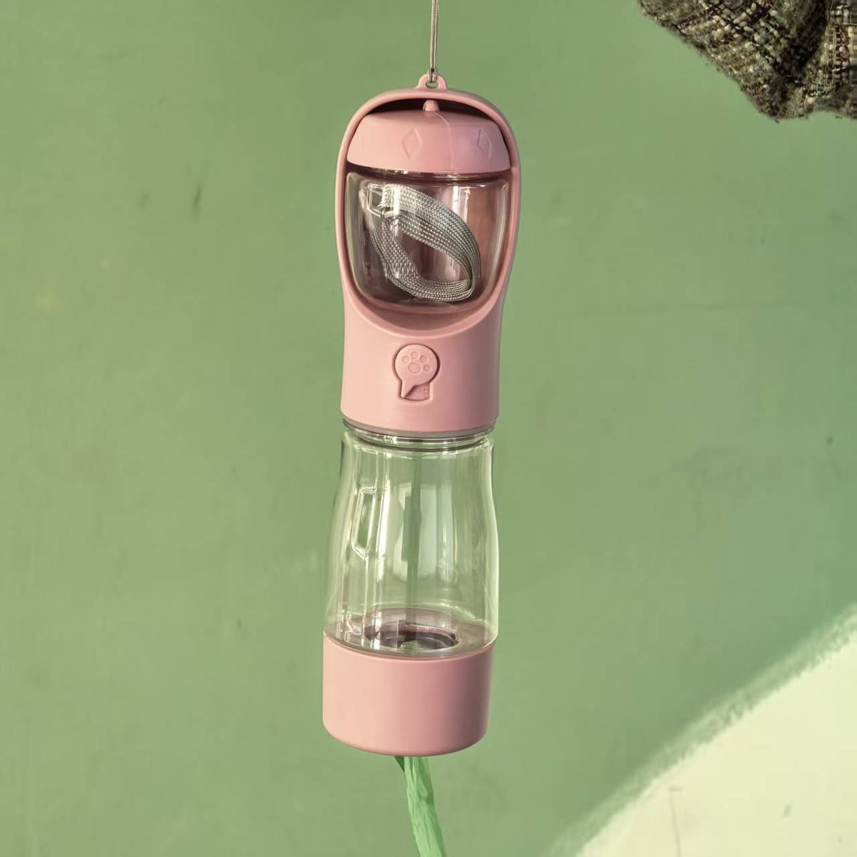 3-in-1 pet travel cup with food store in Blue, in use with a pet