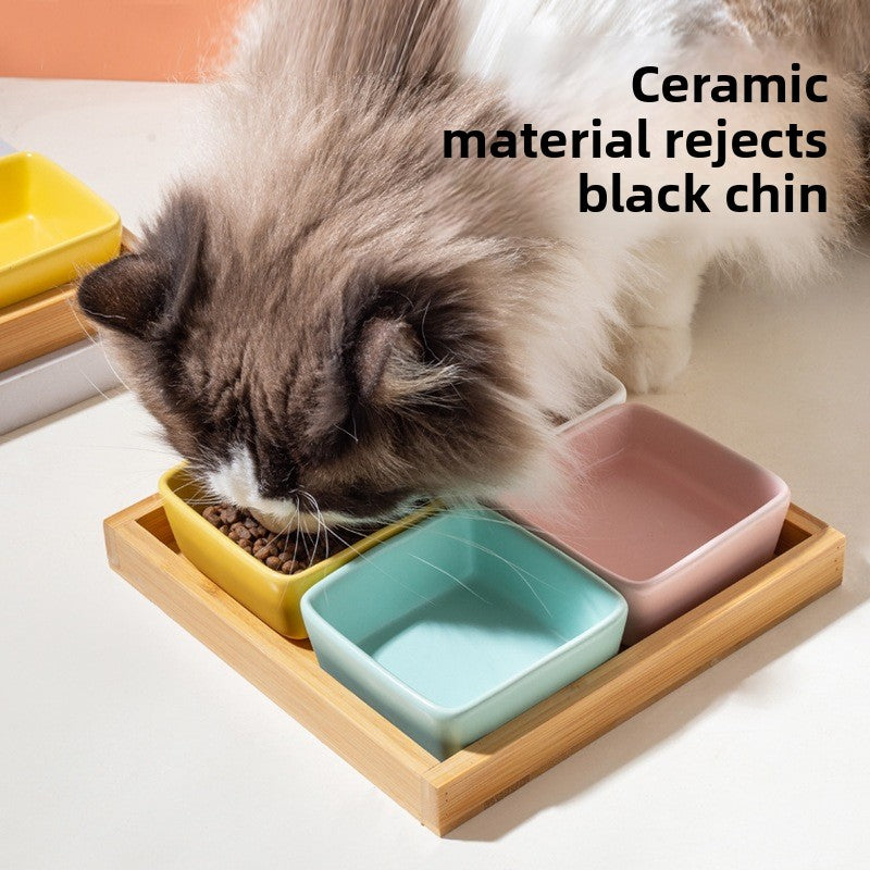 Square ceramic pet dishes on a raised bamboo feeding tray, view 2