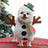Dog dressed in a funny standing snowman costume