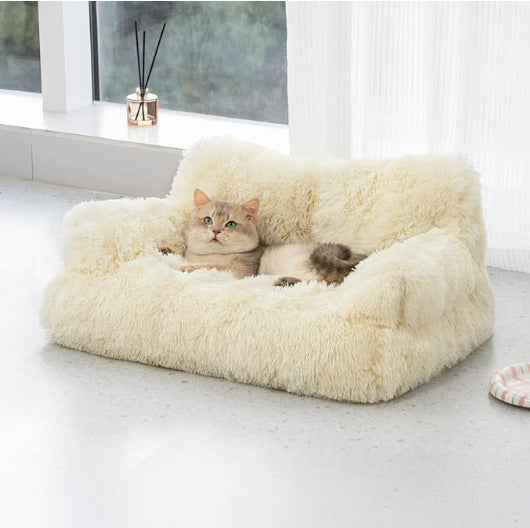 Beige velvet pet sofa bed with raised bolster for dogs and cats