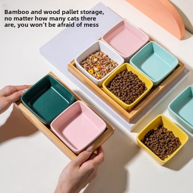 Square ceramic pet dishes on a raised bamboo feeding tray, view 3
