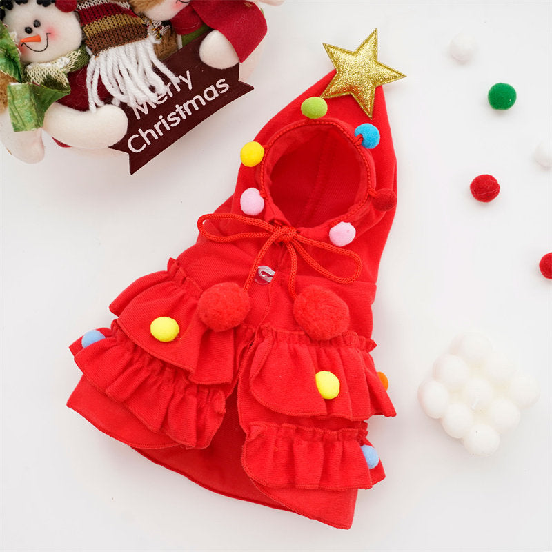 Cat wearing a red Christmas tree pattern cloak