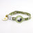 Printed cat collar with tracker tag holder in green on a cat