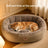 Insulated winter pet bed with toy and raised edges