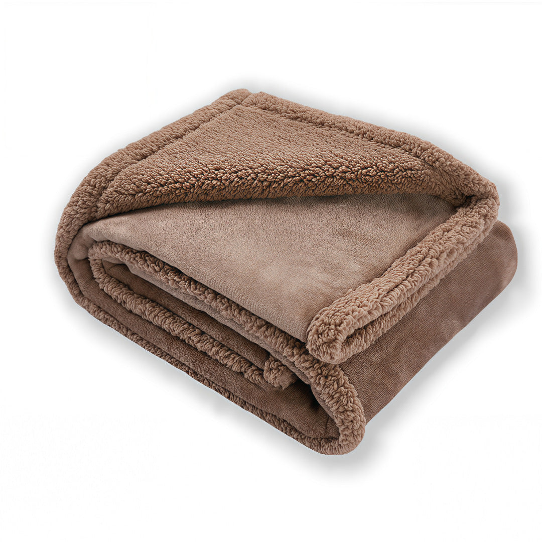 Waterproof double-sided pet blanket in grey on a sofa